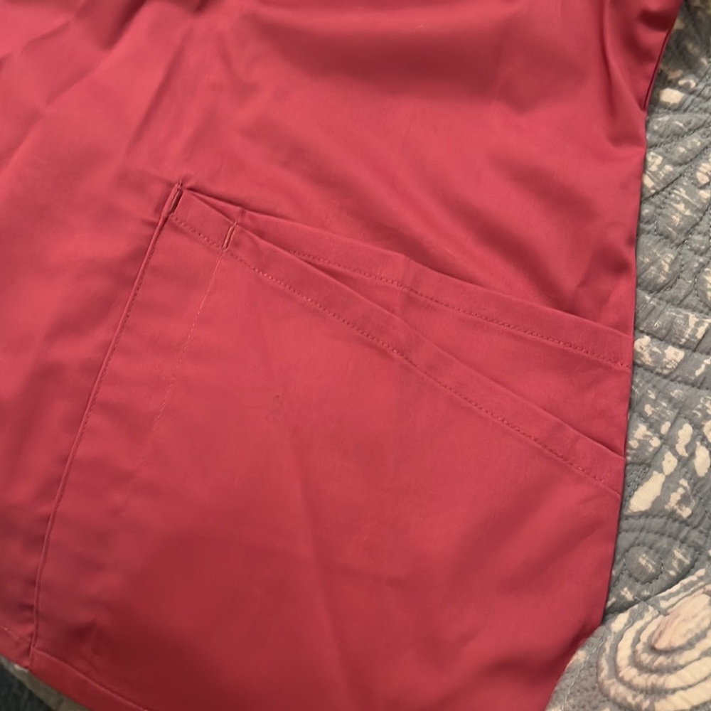 Scrub top. Lots of details. Never worn - Picture 4 of 6